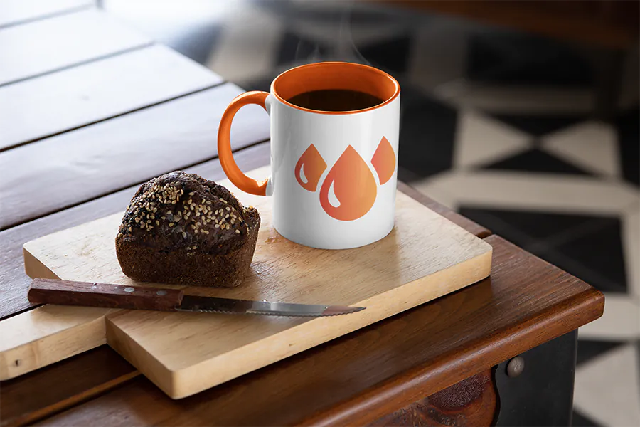 mockup-featuring-an-11-oz-colored-rim-mug-placed-next-to-a-muffin-33190