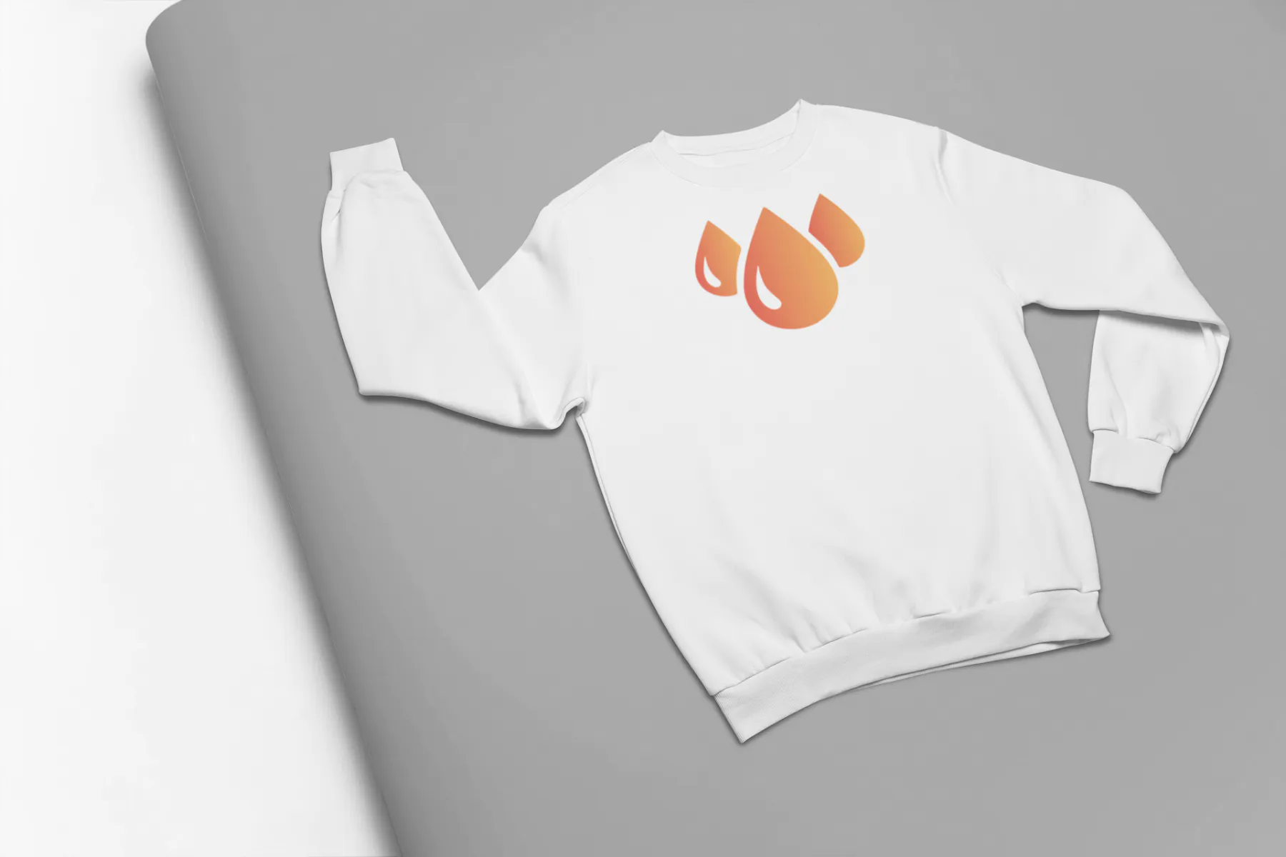 mockup-of-a-crewneck-sweatshirt-lying-on-a-pasteboard-24382