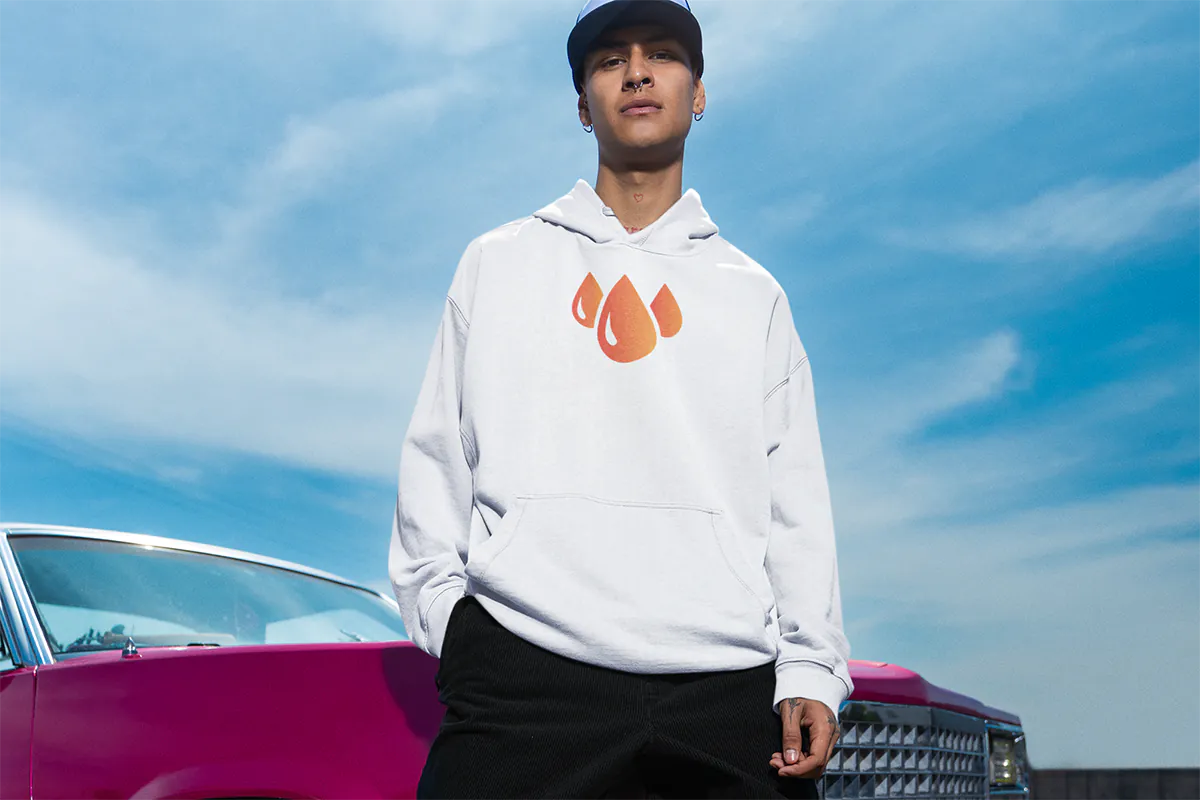 pullover-hoodie-mockup-featuring-a-serious-man-posing-near-a-car-m36825